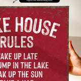 a red sign with white text that reads "Make rules, break rules, take a nap".