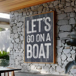 a sign that says let&#39;s go on a boat on a stone wall
