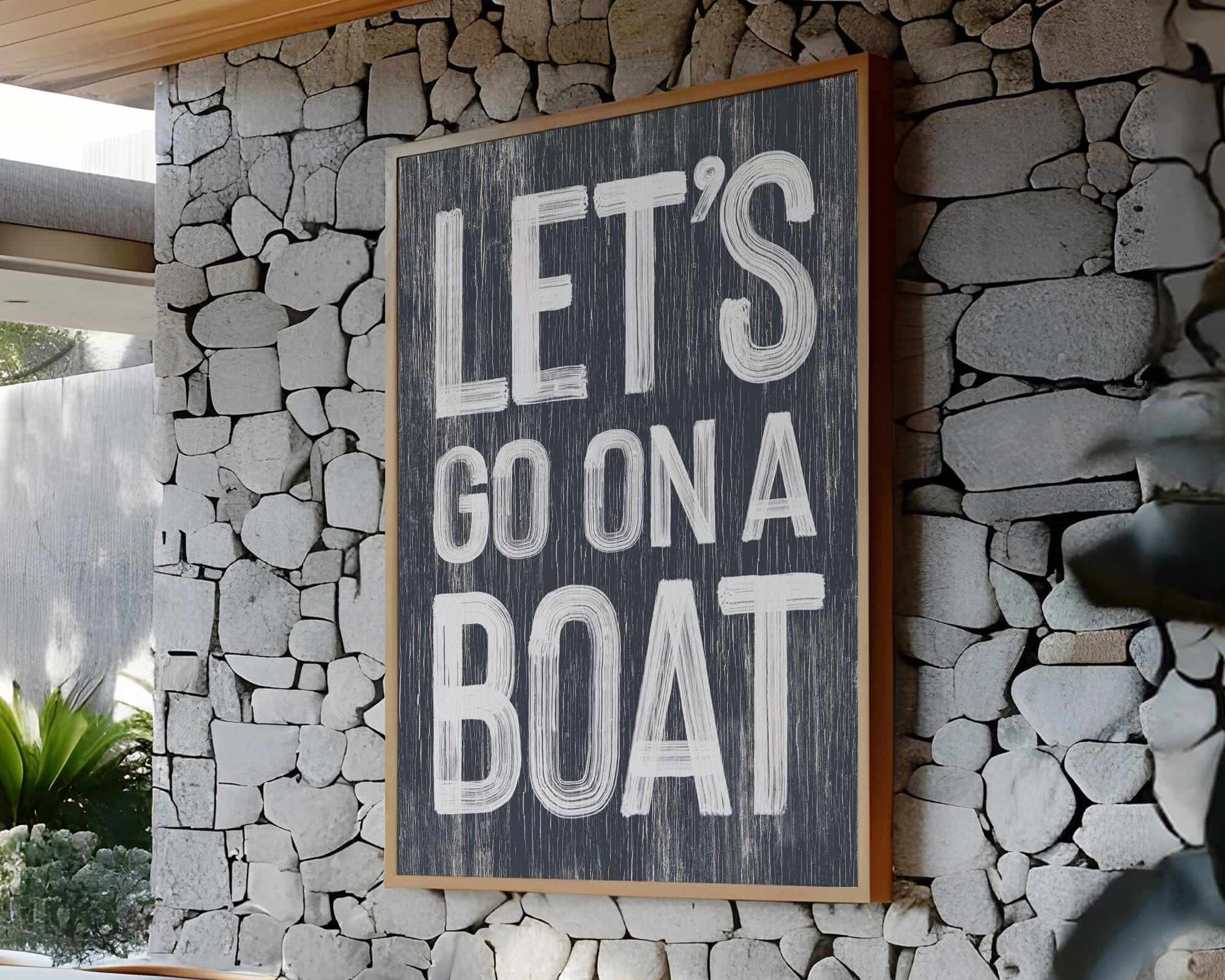 a sign that says let's go on a boat on a stone wall