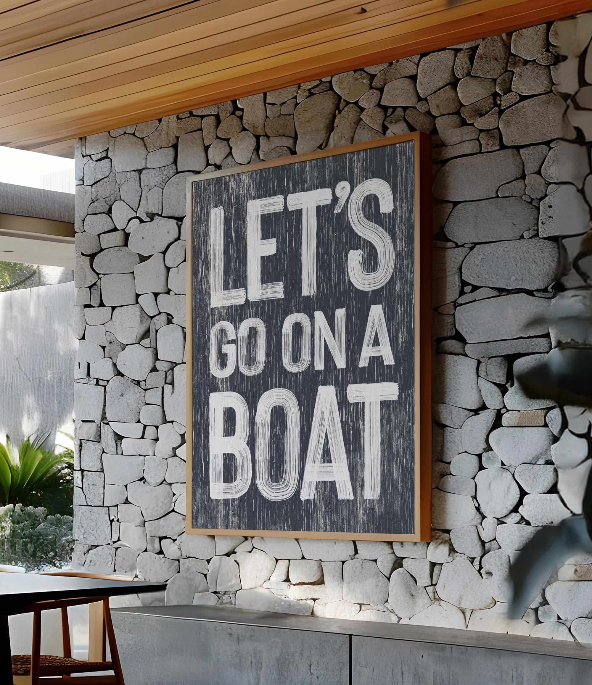 a sign that says let&#39;s go on a boat on a stone wall