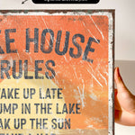 The image is a close-up of a textured, distressed canvas print featuring the phrase "Take a nap" in bold, black letters.