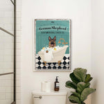 a bathroom with a toilet and a poster on the wall