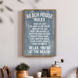 The Beach House Rules Sign in painted wood, harbor blue, hangs above a table with plants and a coffee grinder, bringing coastal charm and wall art style to your space.
