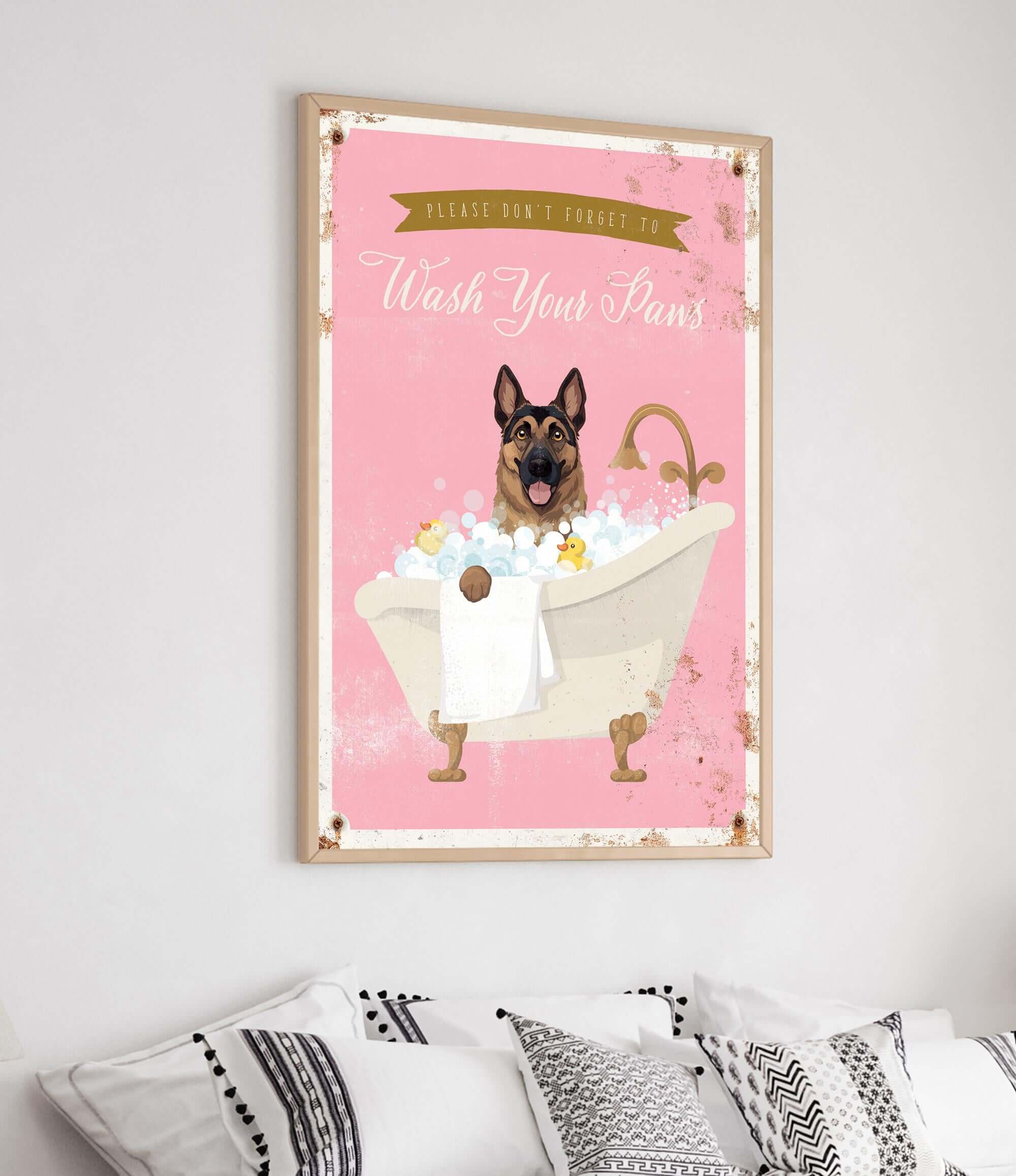 A framed poster with a cartoon image of a German Shepherd dog sitting in a bathtub filled with bubbles, accompanied by the text "Please don't forget to wash your paws".