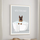 A framed poster with a cartoon image of a dog sitting in a bathtub filled with bubbles, accompanied by the text "WASH YOUR PAWS".