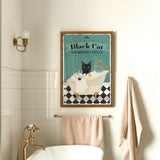a bathroom with a white bath tub and a black cat poster on the wall