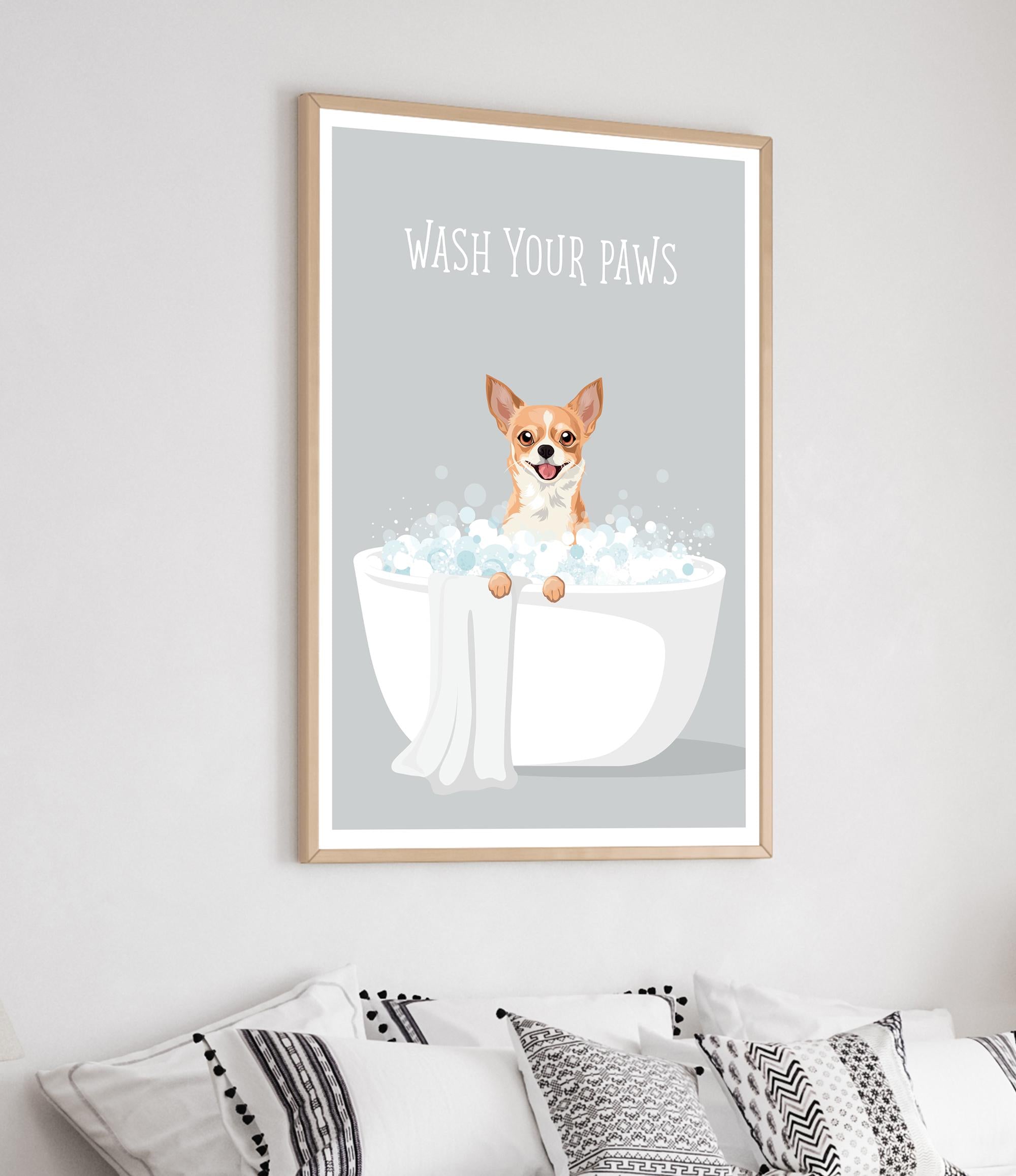 a framed poster with a cartoon illustration of a dog sitting in a bathtub filled with bubbles, with the text "WASH YOUR PAWS" written above it.