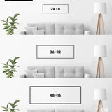 a series of three framed artworks or photographs displayed on a wall, each with a different size and frame. The artworks are arranged in a row, with the largest one being 24 x 8 inches, followed by a smaller one of 36 x 12 inches, and the smallest one being 48 x 16 inches. The artworks are set against a white wall, and there is a plant in the background.