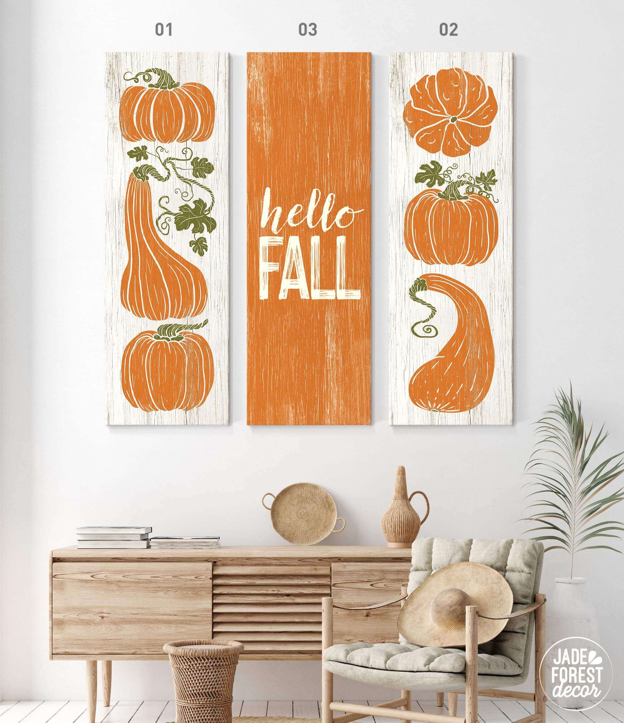 a living room with two paintings of pumpkins on the wall