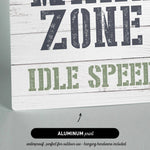 a wooden sign that says wake zone idle speed