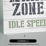 a wooden sign that says wake zone idle speed