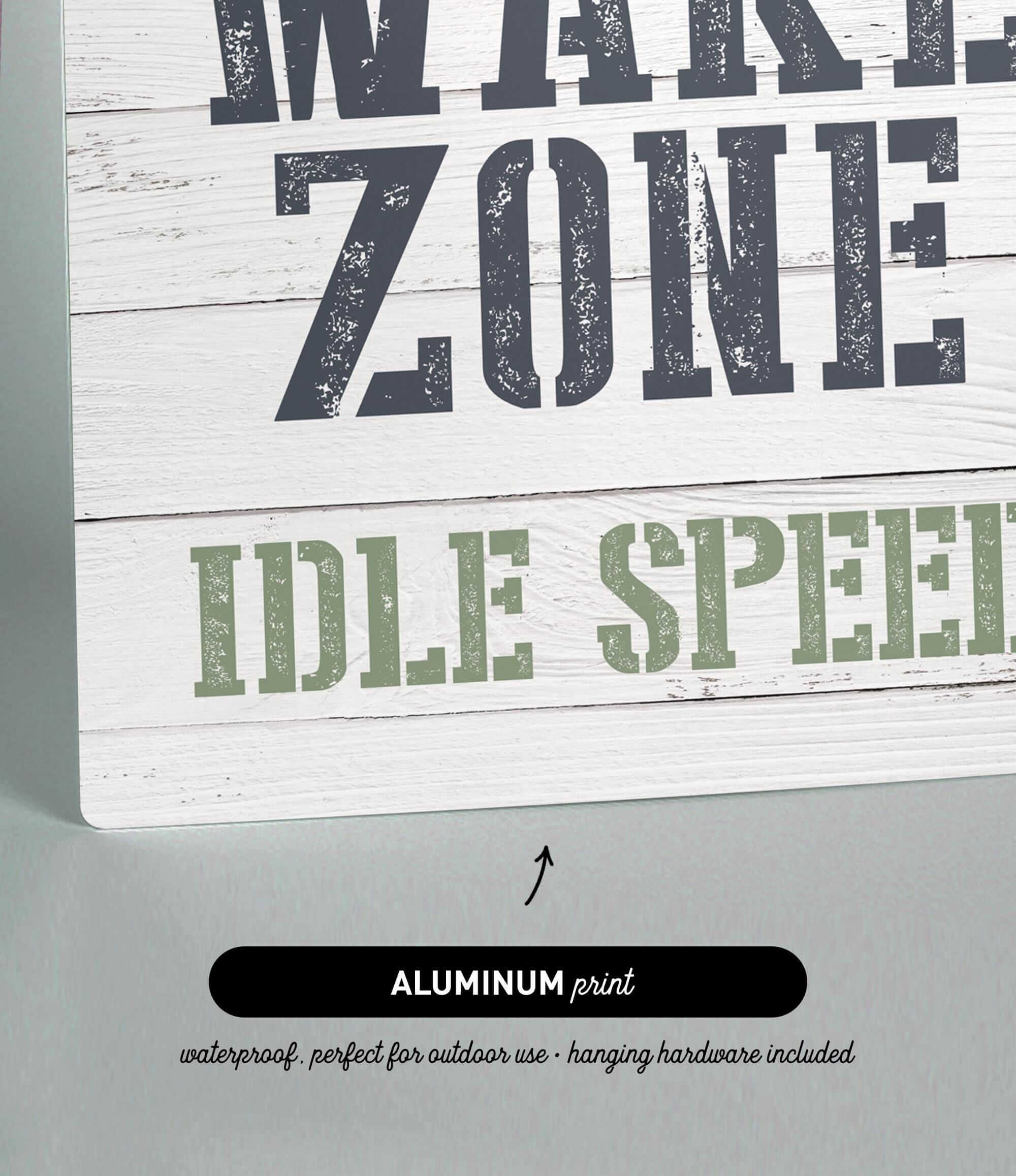 a wooden sign that says wake zone idle speed