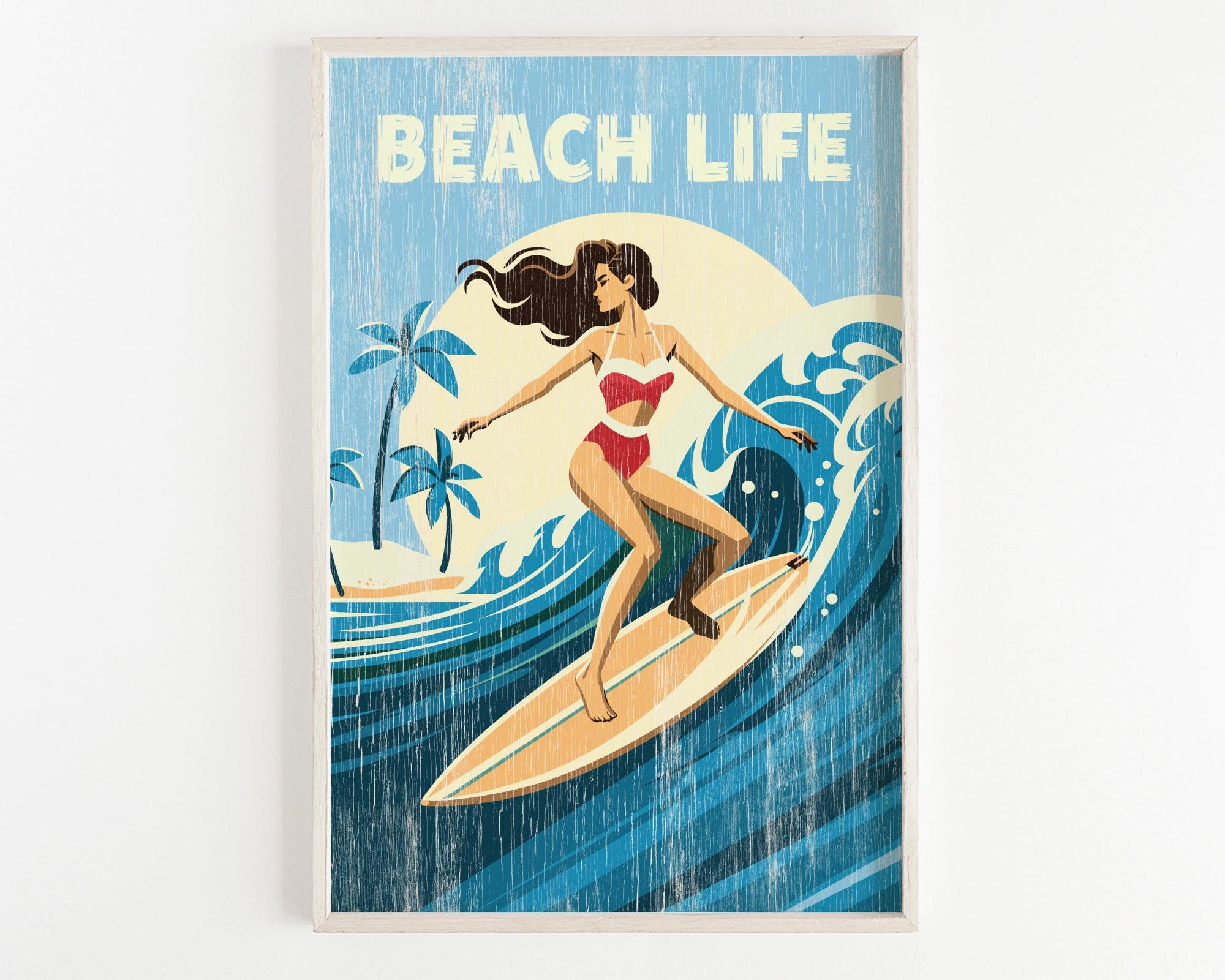 A framed illustration of a woman surfing on a wave, with the text "BEACH LIFE" prominently displayed.