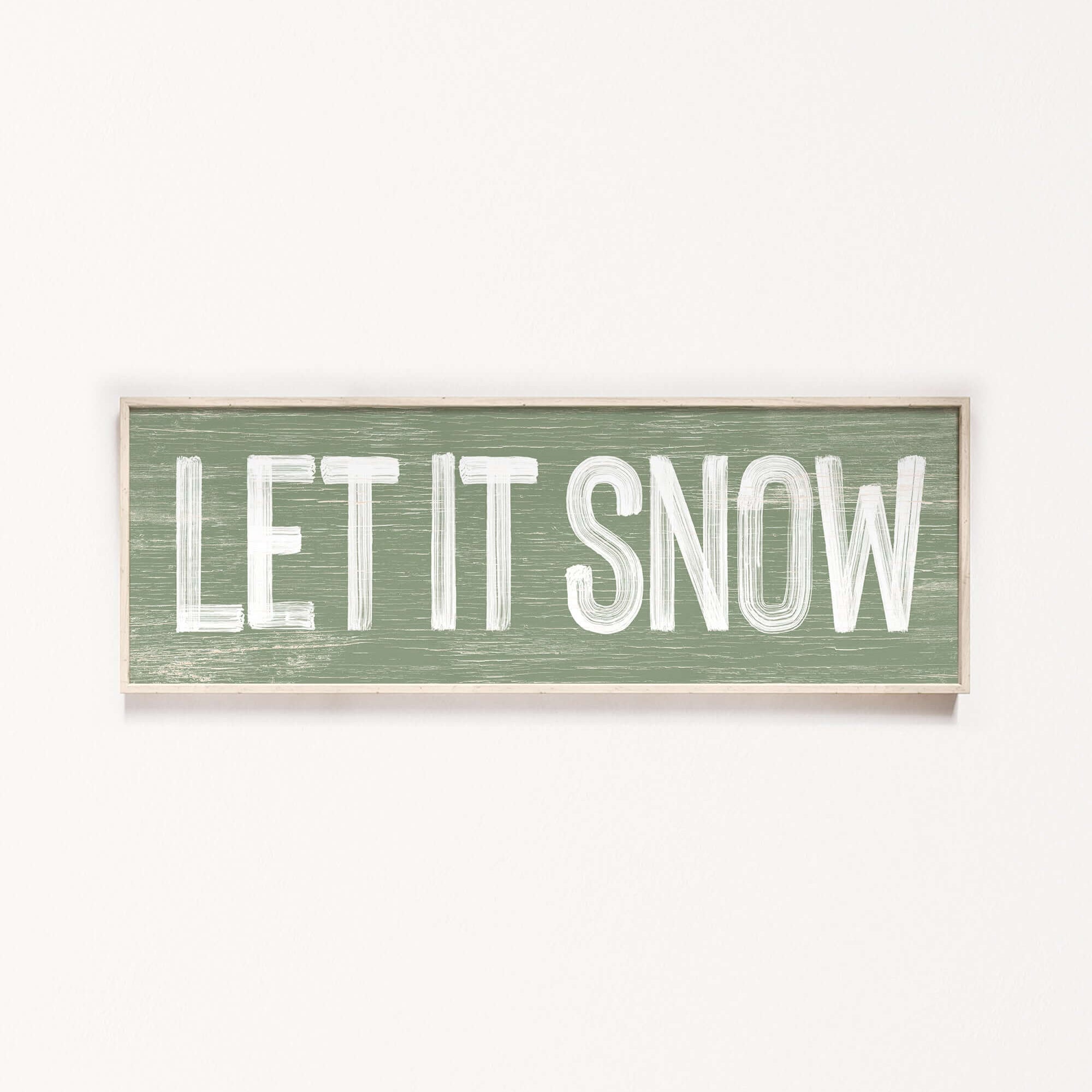 a wooden sign that says let it snow