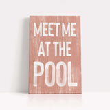 a wooden sign that says meet me at the pool