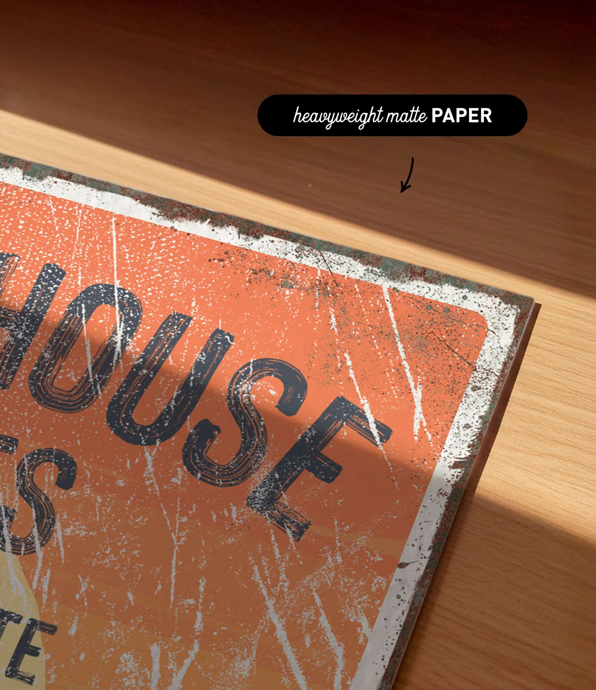 a close-up of a worn, orange-colored sign with the word "HOUSE" written on it.