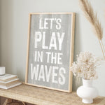 a wooden sign that says let&#39;s play in the waves