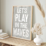 a wooden sign that says let&#39;s play in the waves