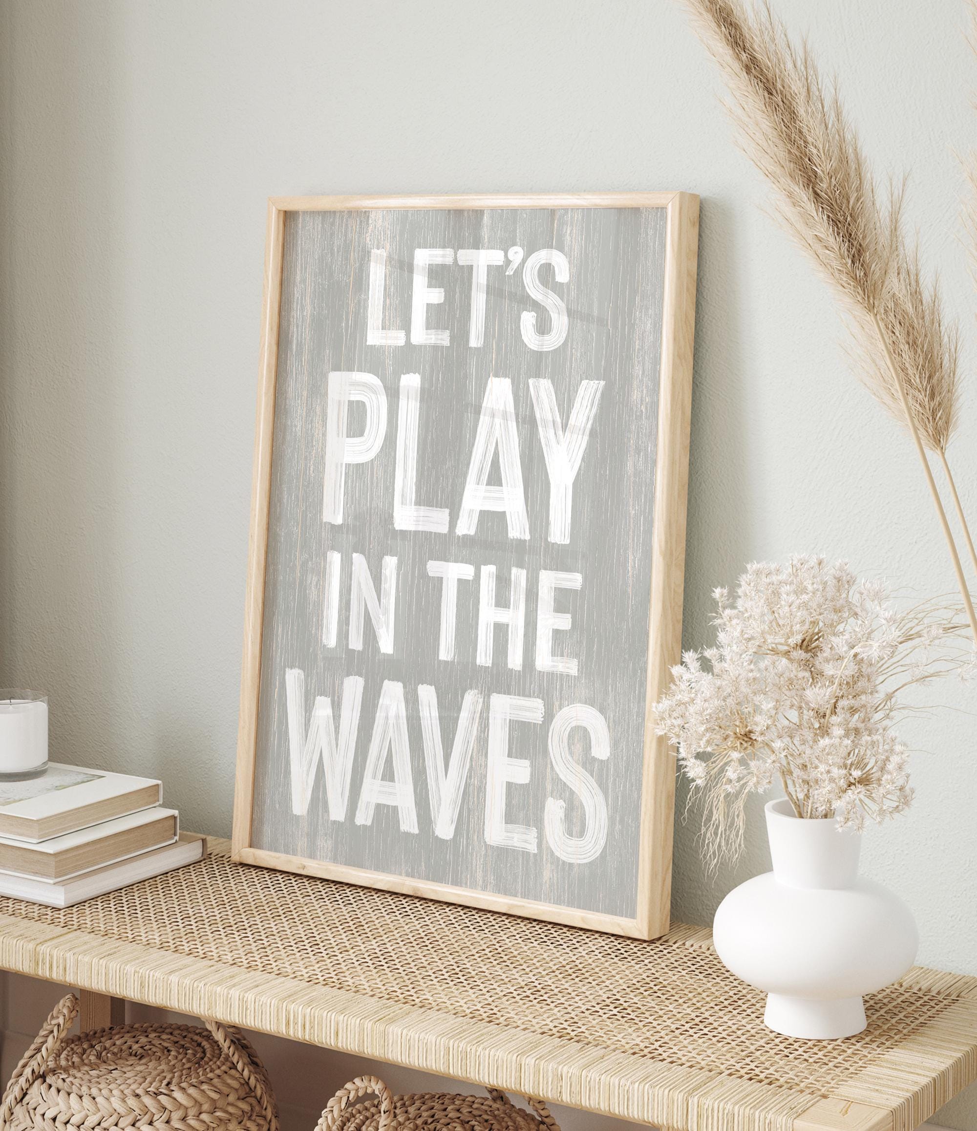 a wooden sign that says let&#39;s play in the waves