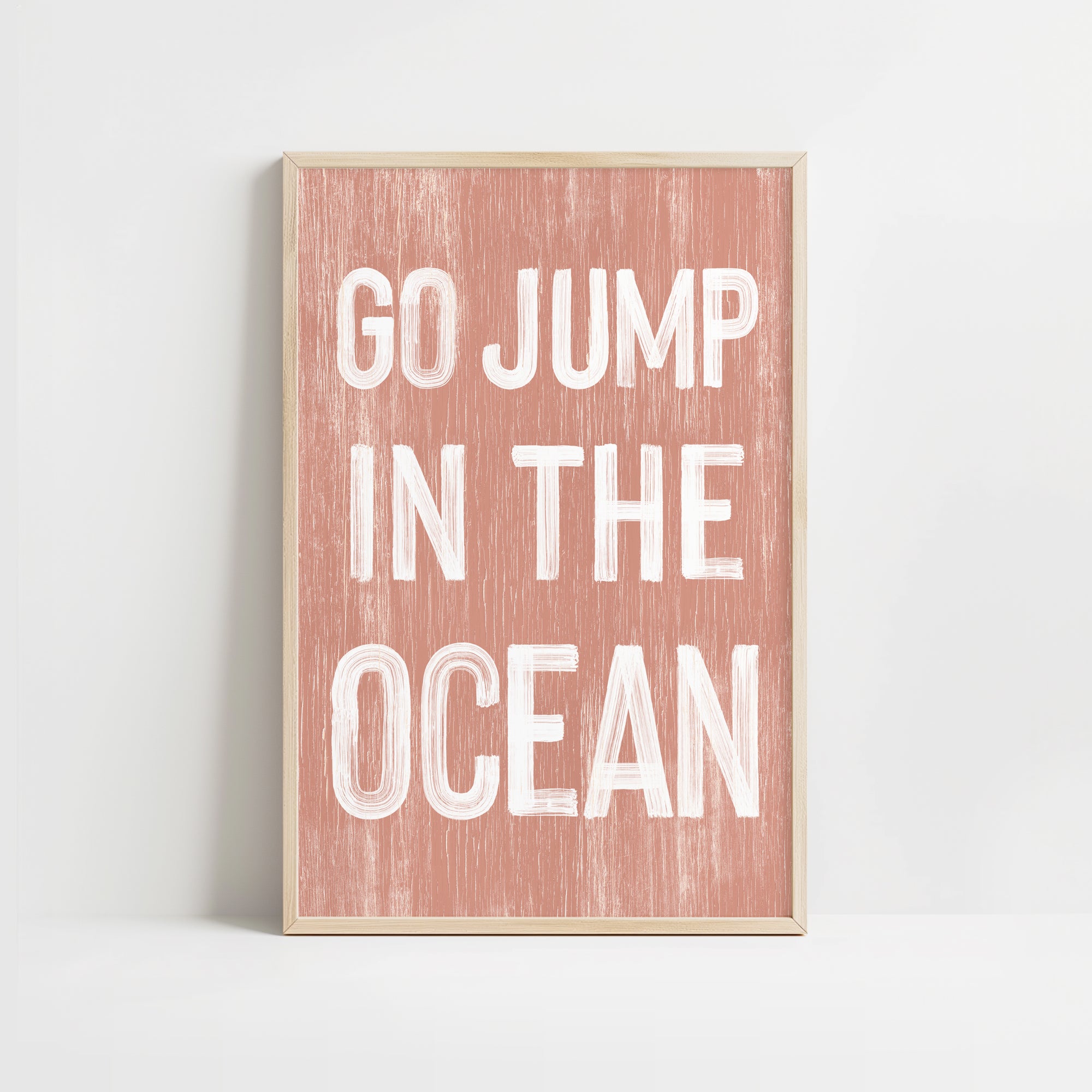 a pink and white print with the words go jump in the ocean