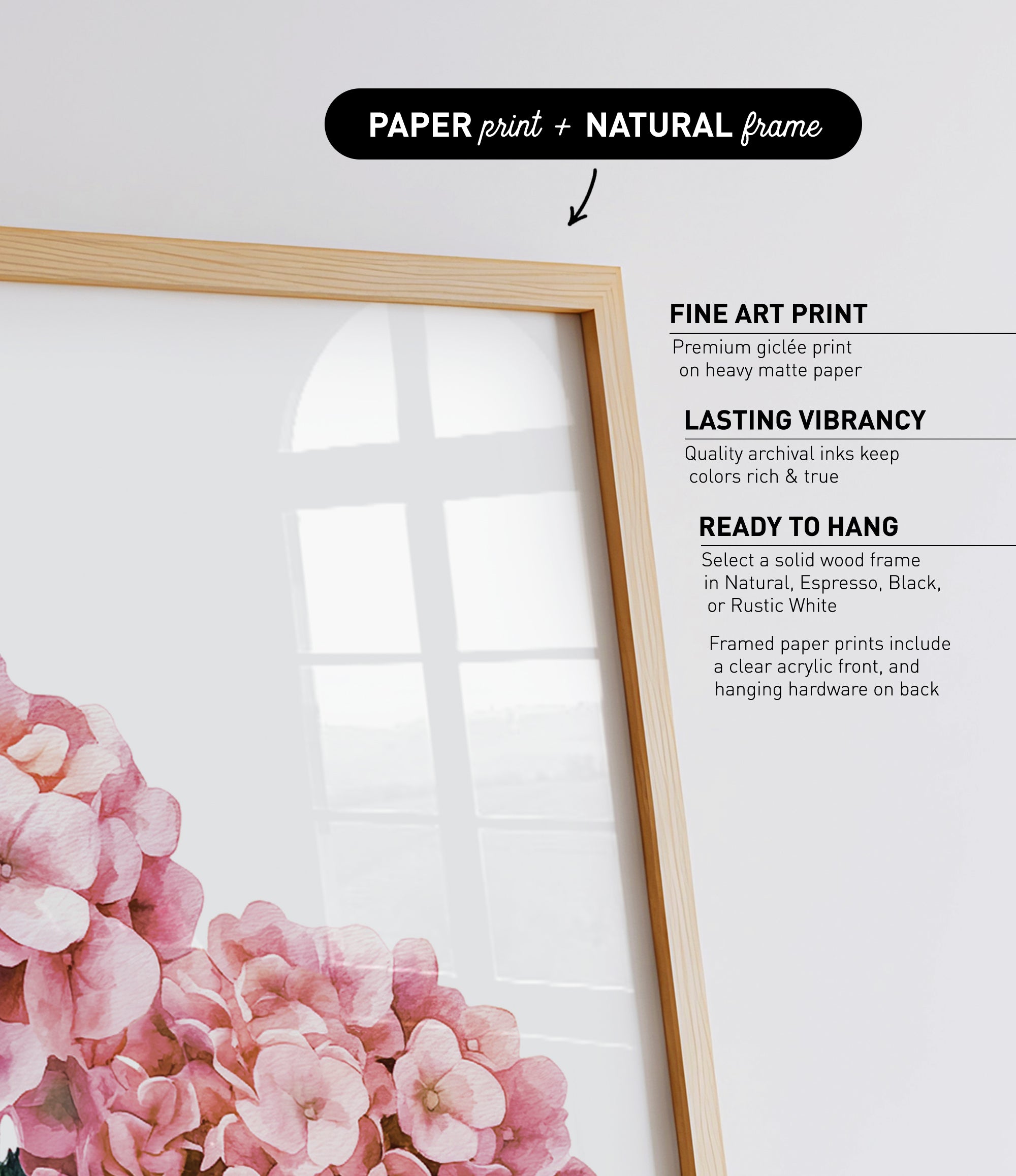 a framed print of pink flowers, with a natural frame.