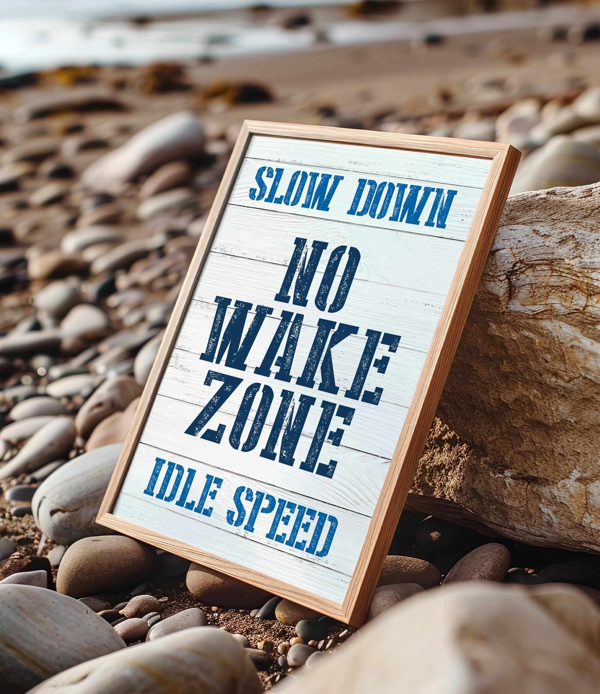 a sign sitting on top of a pile of rocks