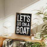 a wooden sign that says let&#39;s go on a boat