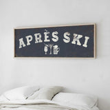a bedroom with a bed and a framed sign that reads "APRES SKI" above it.