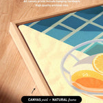 a wooden frame with a framed artwork depicting a bowl of fruit, including oranges and a lemon, on a wooden surface.