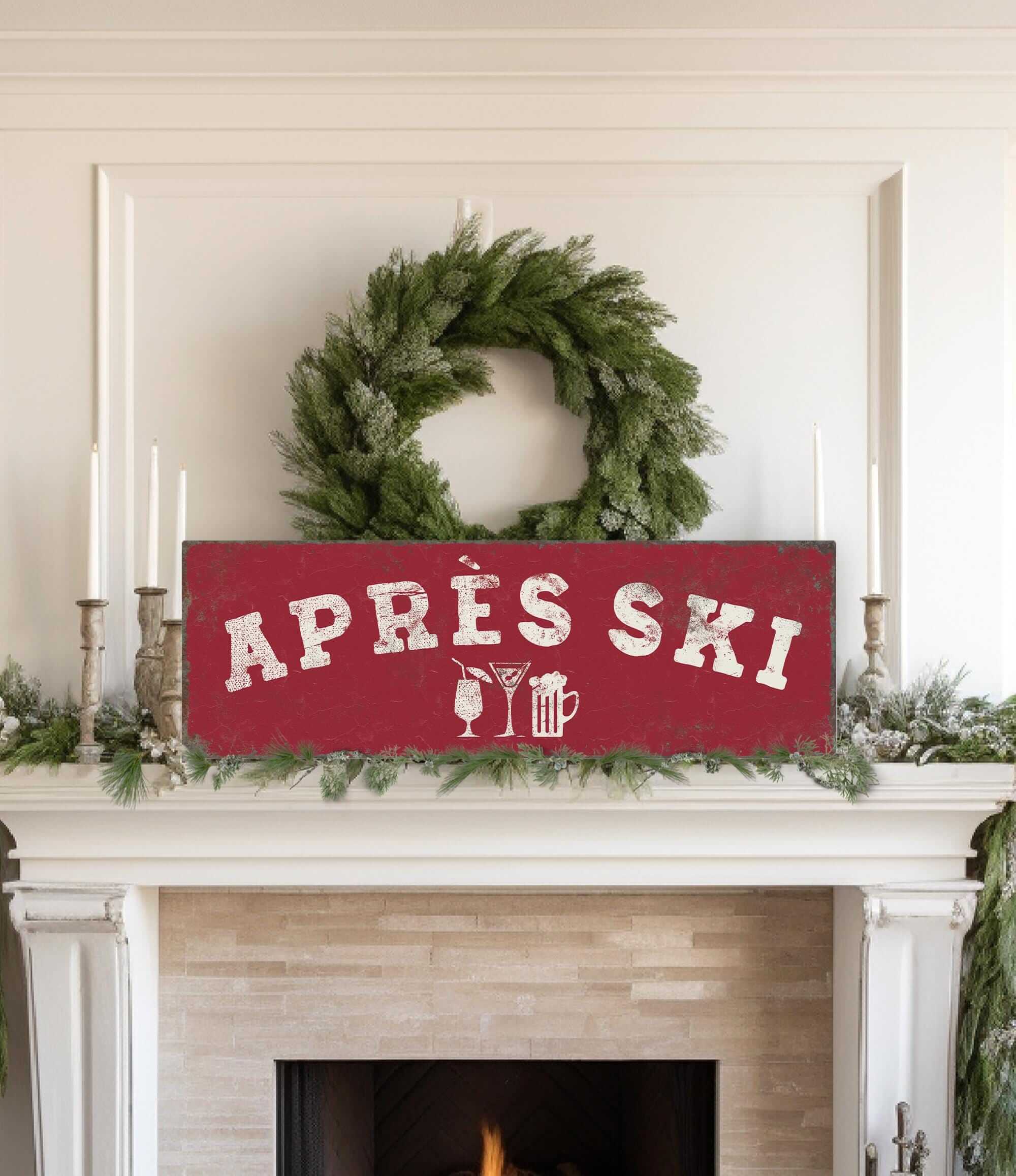 a fireplace decorated with a wreath, candles, and a red sign that says "APRés Ski".