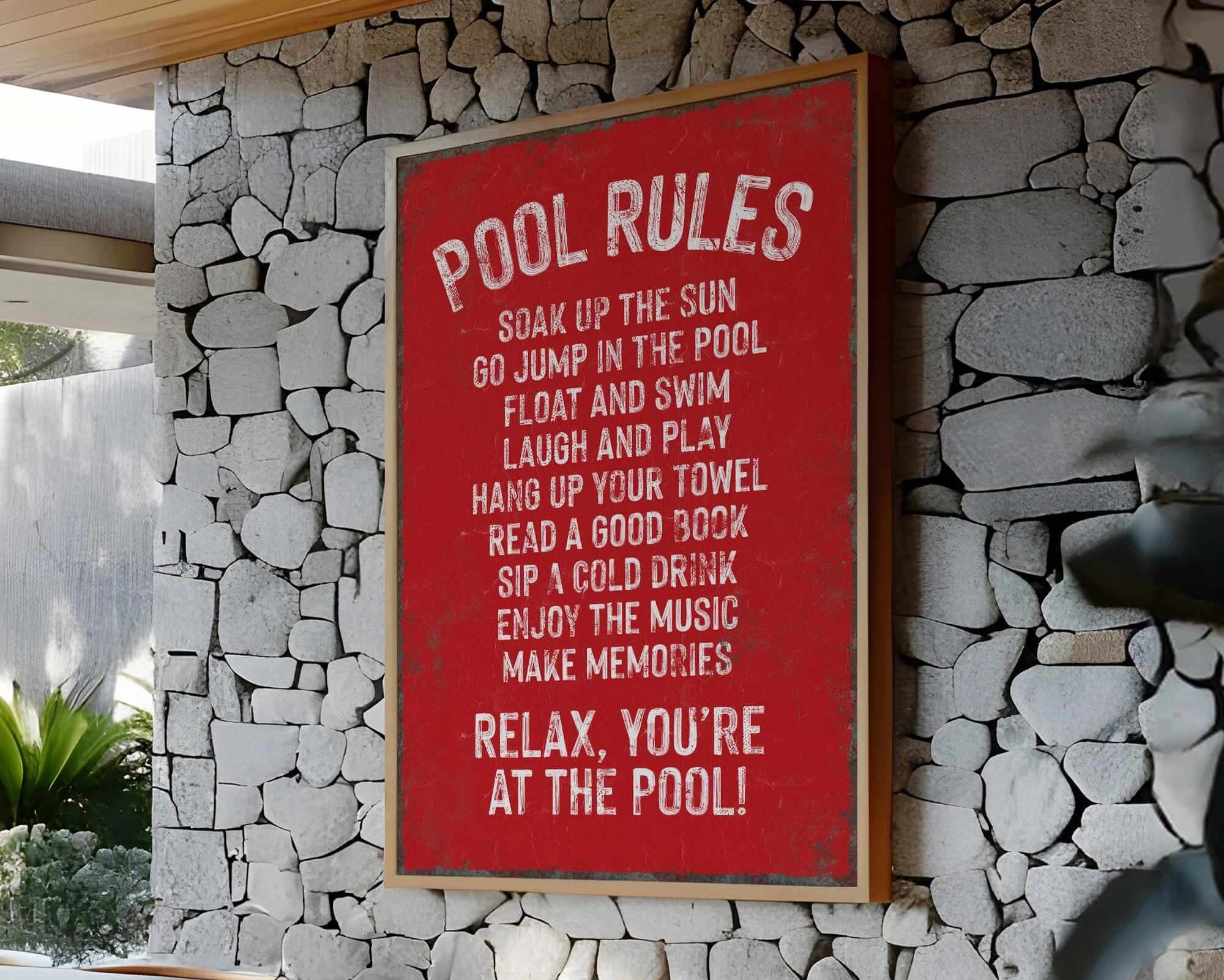 a red sign on a stone wall next to a table