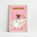 A framed poster with a cartoon image of a dog sitting in a bathtub filled with bubbles, accompanied by the text "Please don't forget to wash your paws".