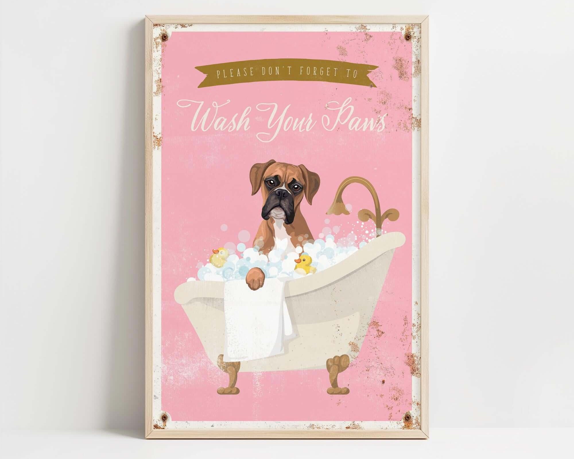 A framed poster with a cartoon image of a dog sitting in a bathtub filled with bubbles, accompanied by the text "Please don't forget to wash your paws".