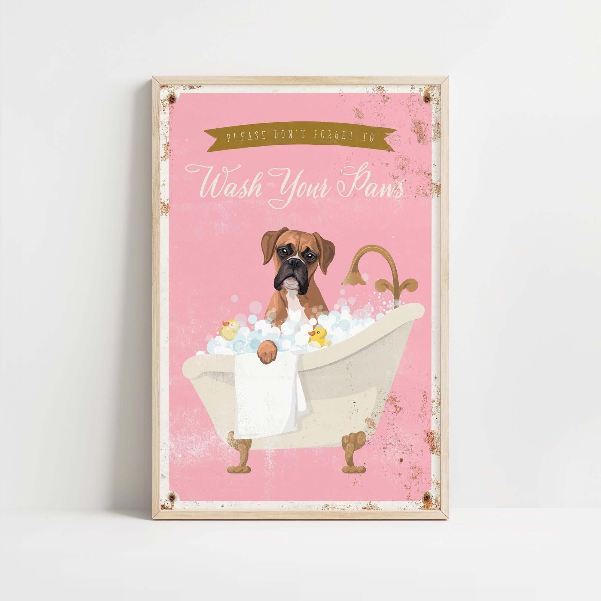 A framed poster with a cartoon image of a dog sitting in a bathtub filled with bubbles, accompanied by the text "Please don't forget to wash your paws".