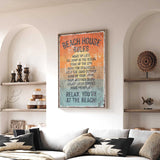 a living room with a large framed sign that reads "BEACH HOUSE RULES" hanging on the wall. The sign lists various beach-related rules, such as "Make up at the beach", "JUMP IN THE OCEAN", and "KEEP THE SEASHELLS HANDLEED OUTSIDE". The room also includes a couch, decorative items, and shelves, creating a cozy and beach-themed atmosphere.