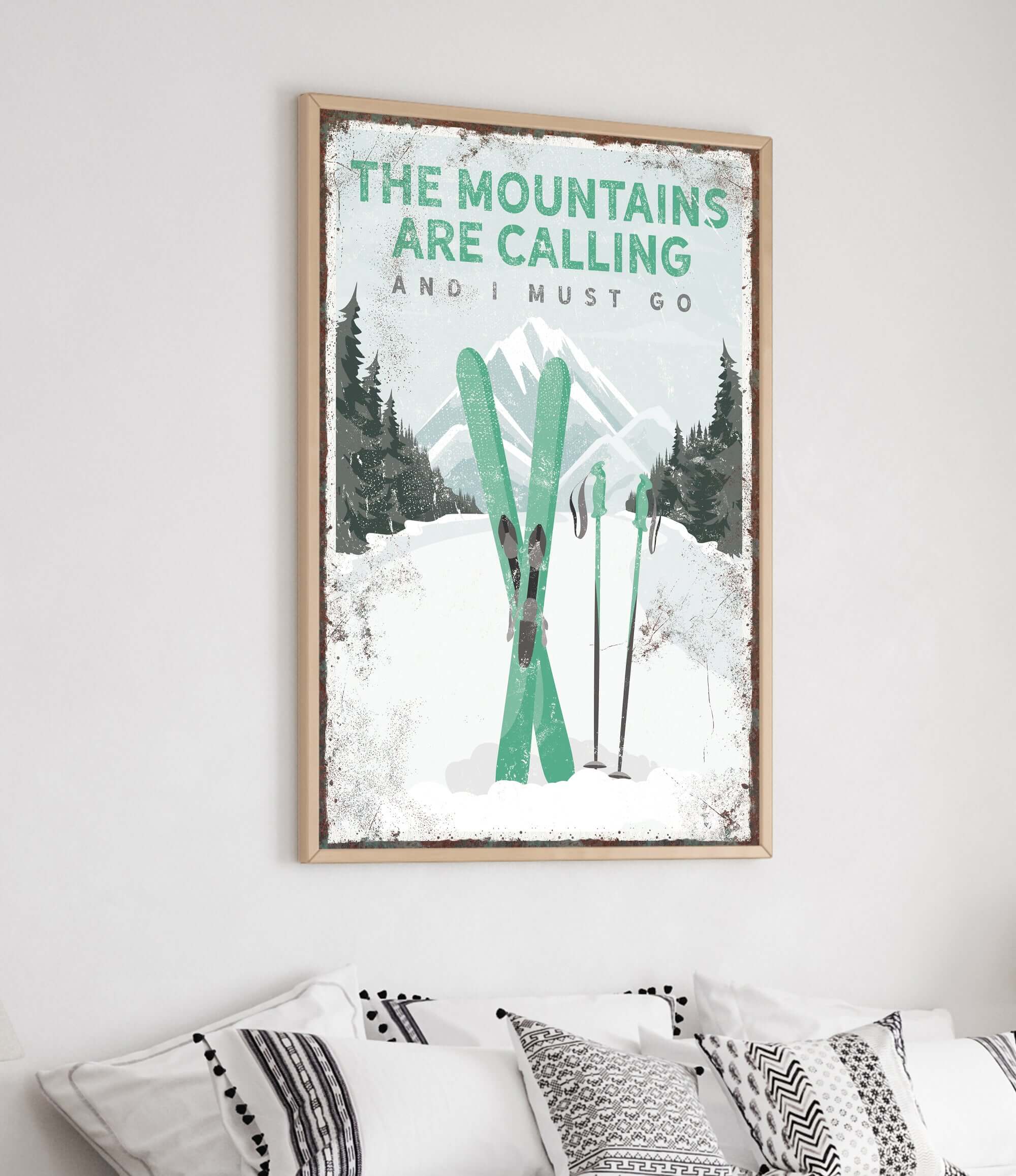 a poster of skis hanging on a wall above a bed