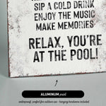 a sign that reads relax you&#39;re at the pool