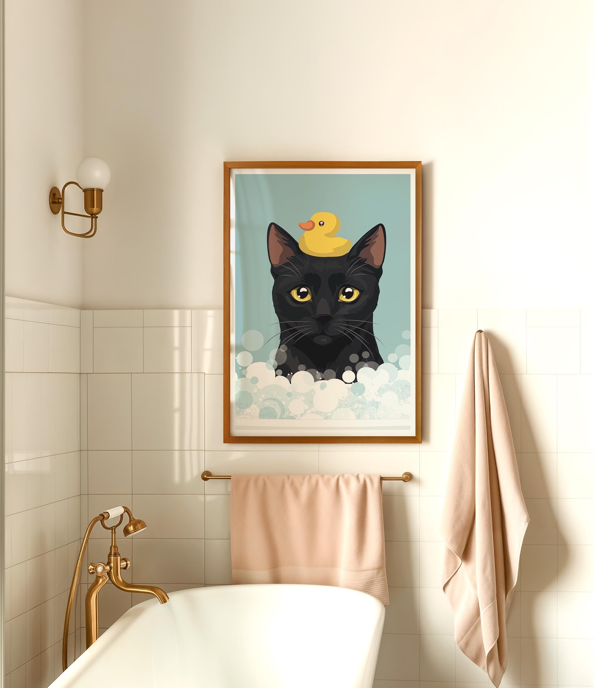 A framed illustration of a black cat with a yellow rubber duck on its head is displayed on the wall above a white bathtub in a bathroom.