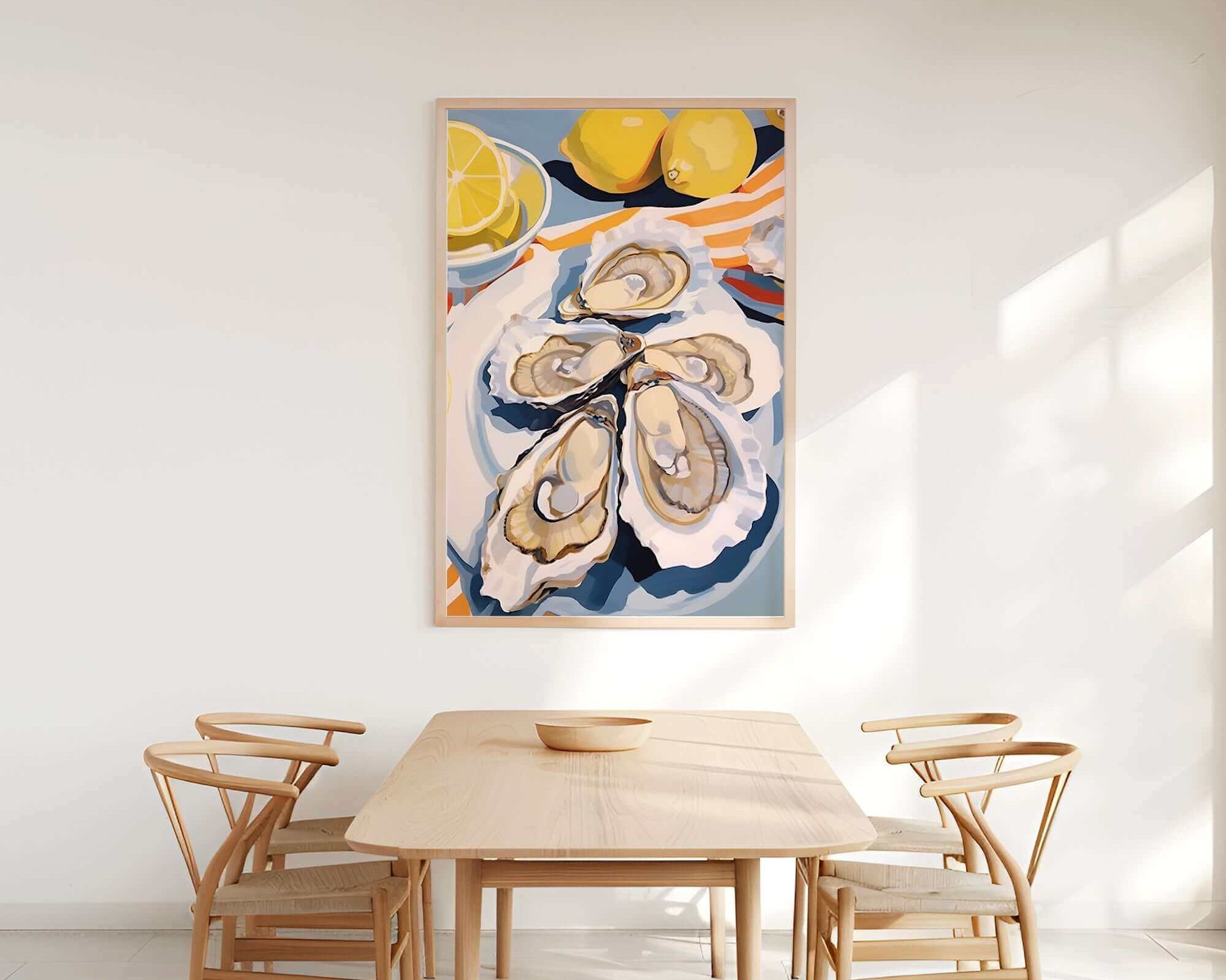 a dining room with a wooden table and four chairs. Above the table, there is a large painting of oysters and lemons on a white wall.