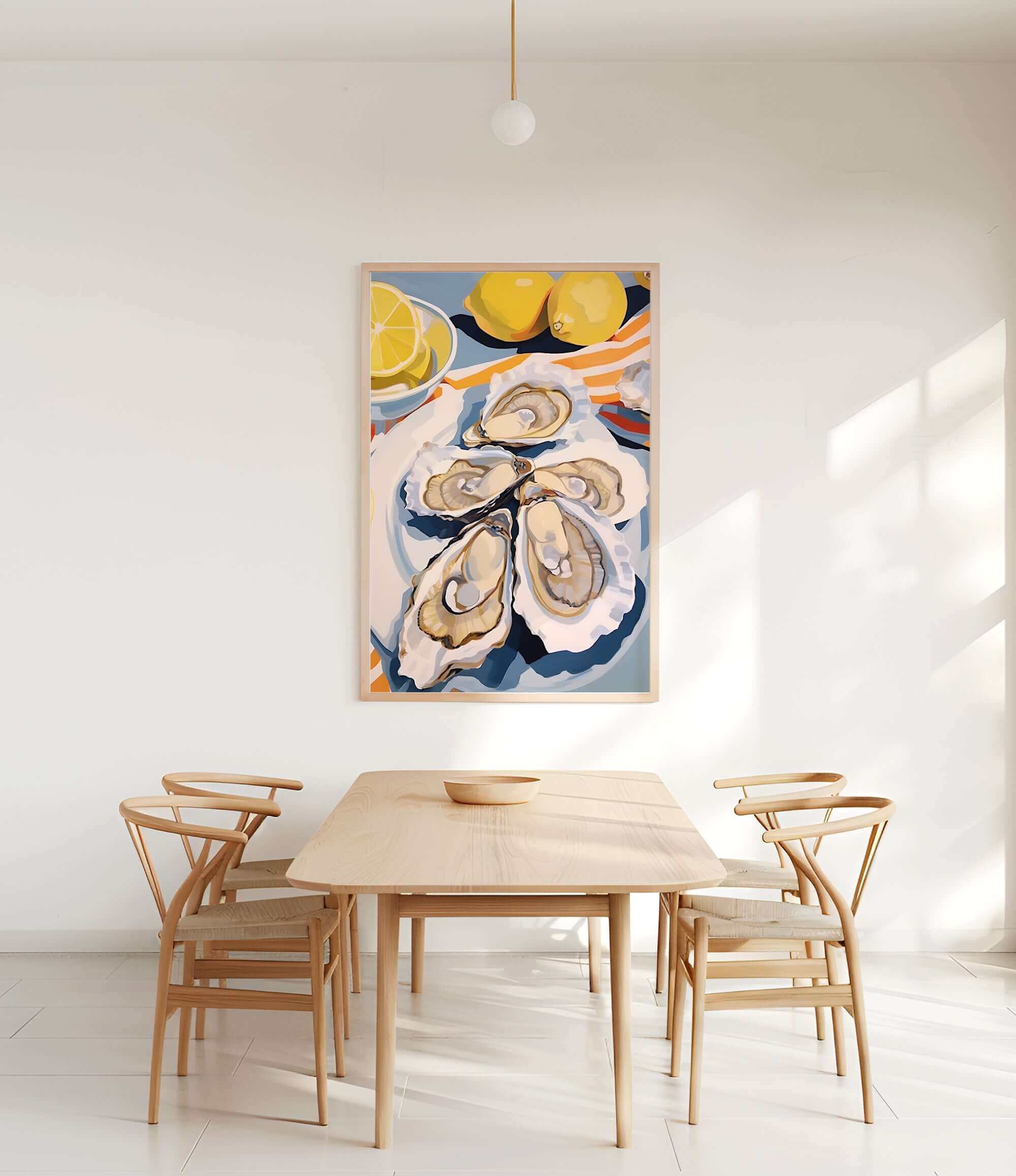 a dining room with a wooden table and four chairs. Above the table, there is a large painting of oysters and lemons on a white wall.