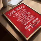 a red sign sitting on top of a wooden table