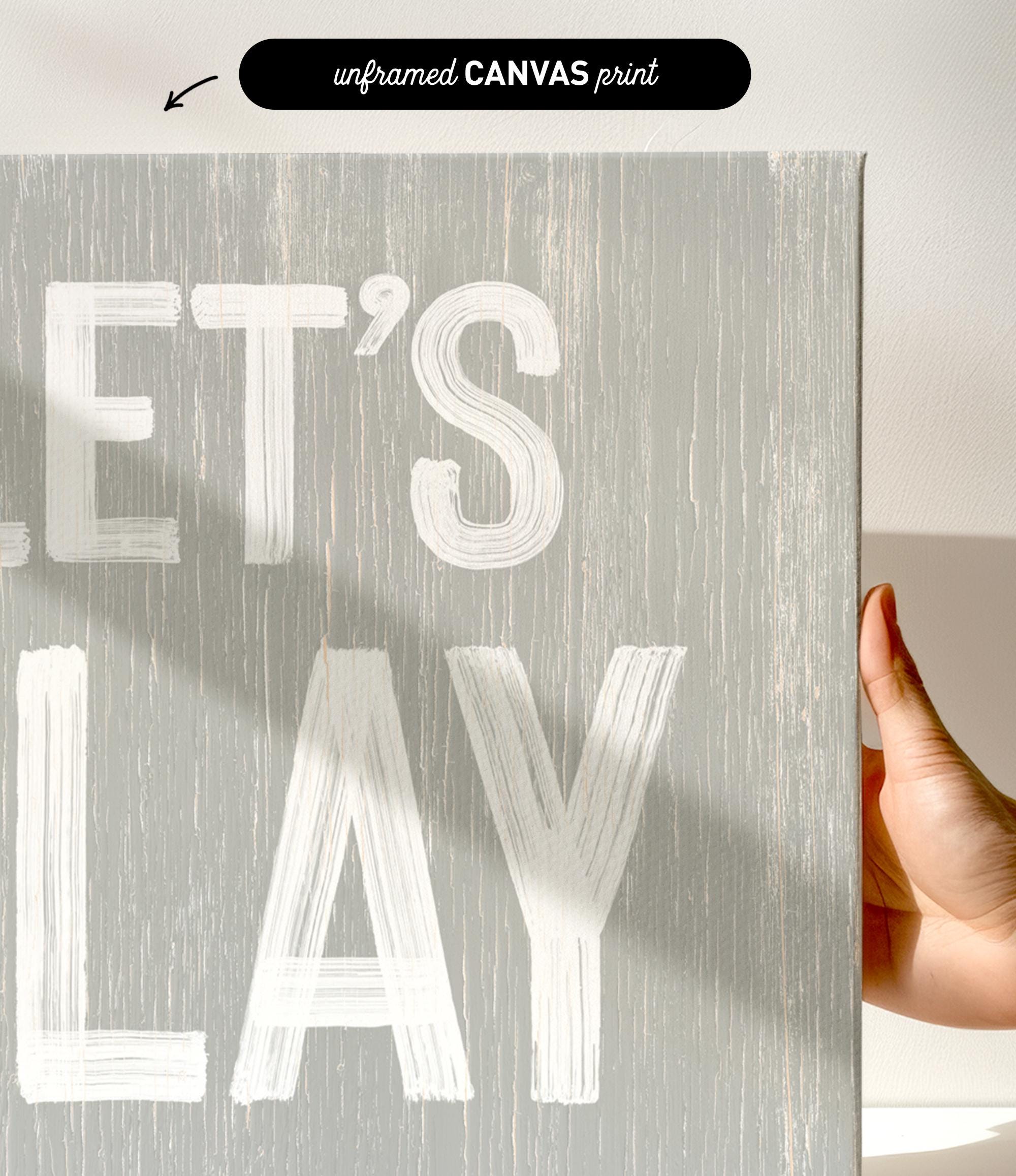 a hand holding a sign that says let&#39;s play