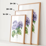 three framed prints of a watercolor painting of purple hydrangeas, each with a different size and frame.