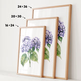 three framed prints of a watercolor painting of purple hydrangeas, each with a different size and frame.