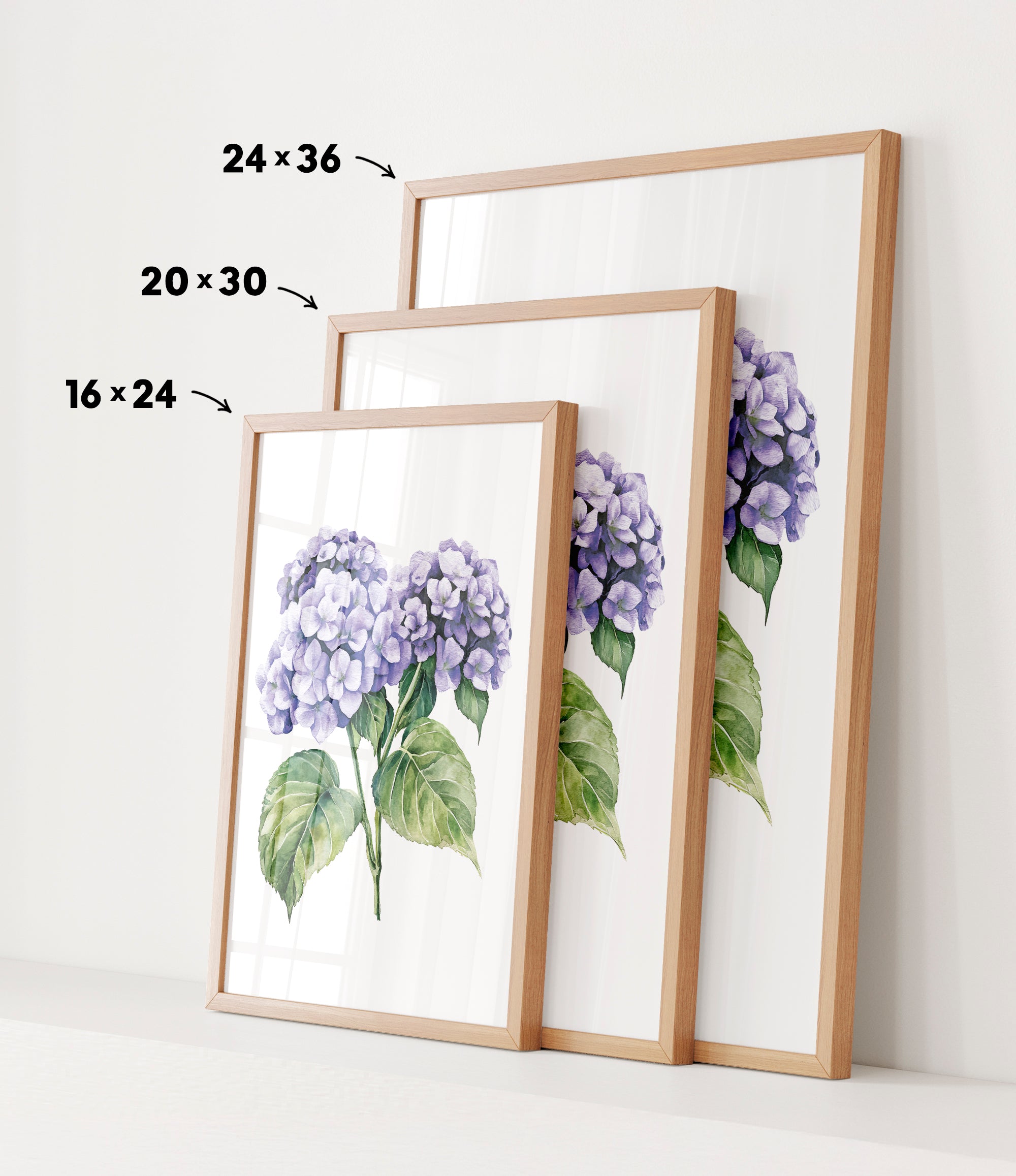 three framed prints of a watercolor painting of purple hydrangeas, each with a different size and frame.