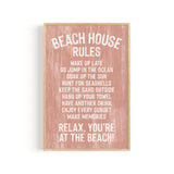 The Beach House Rules Sign, Painted Wood in Coral, displays relaxing beach activities—ideal as coastal wall art or beach house decor for your serene seaside retreat.