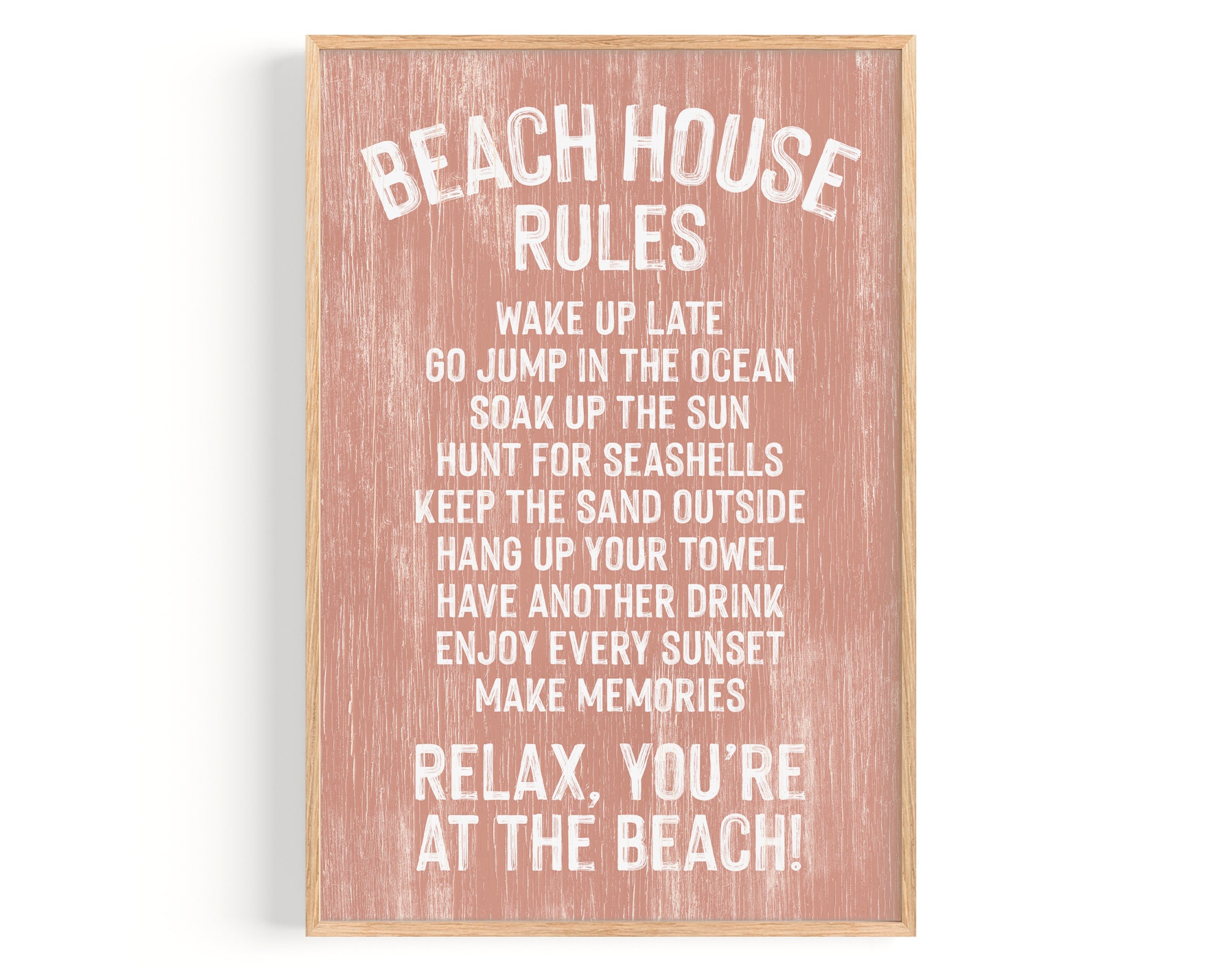 The Beach House Rules Sign, Painted Wood in Coral, displays relaxing beach activities—ideal as coastal wall art or beach house decor for your serene seaside retreat.