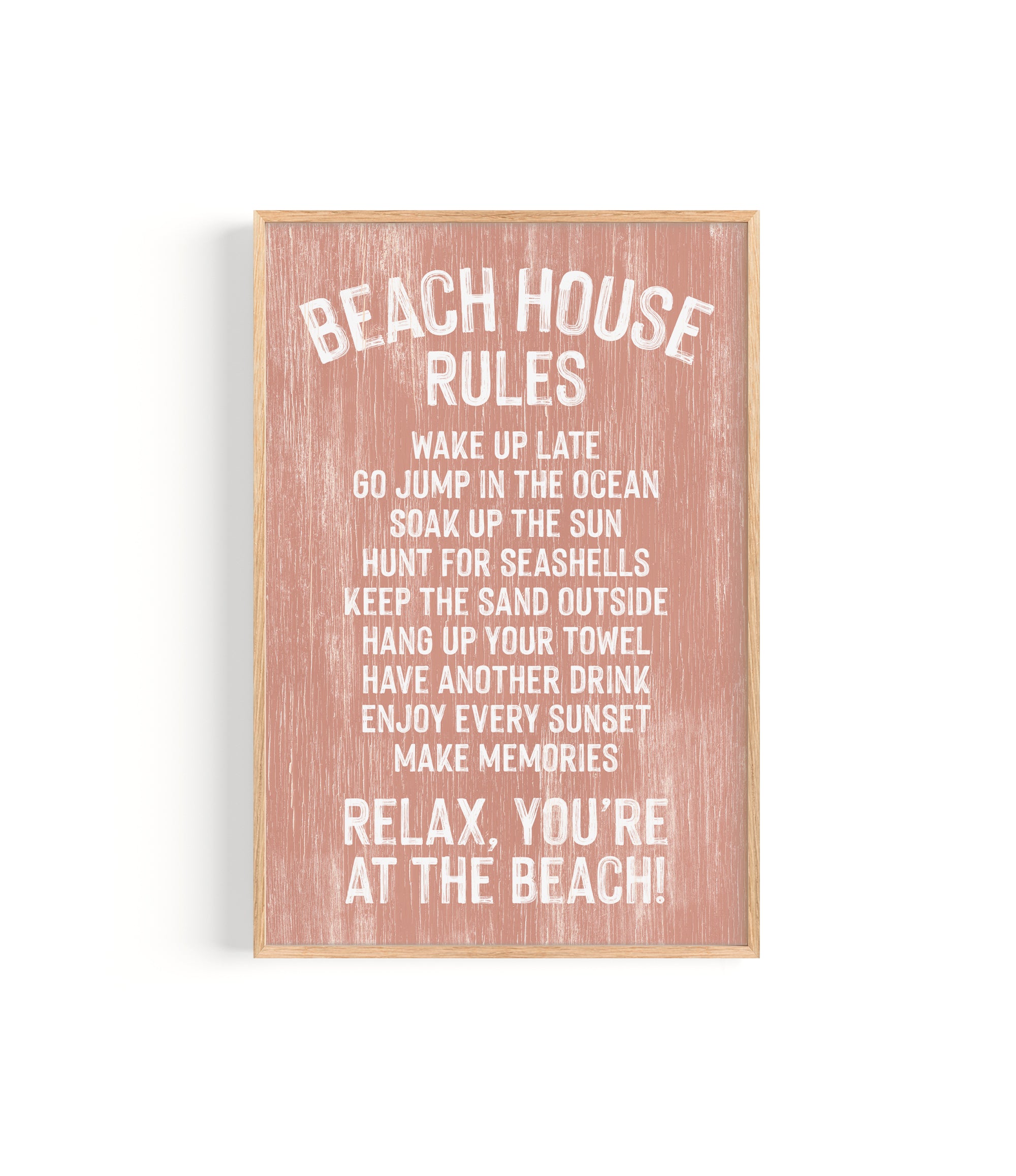 The Beach House Rules Sign, Painted Wood in Coral, displays relaxing beach activities—ideal as coastal wall art or beach house decor for your serene seaside retreat.