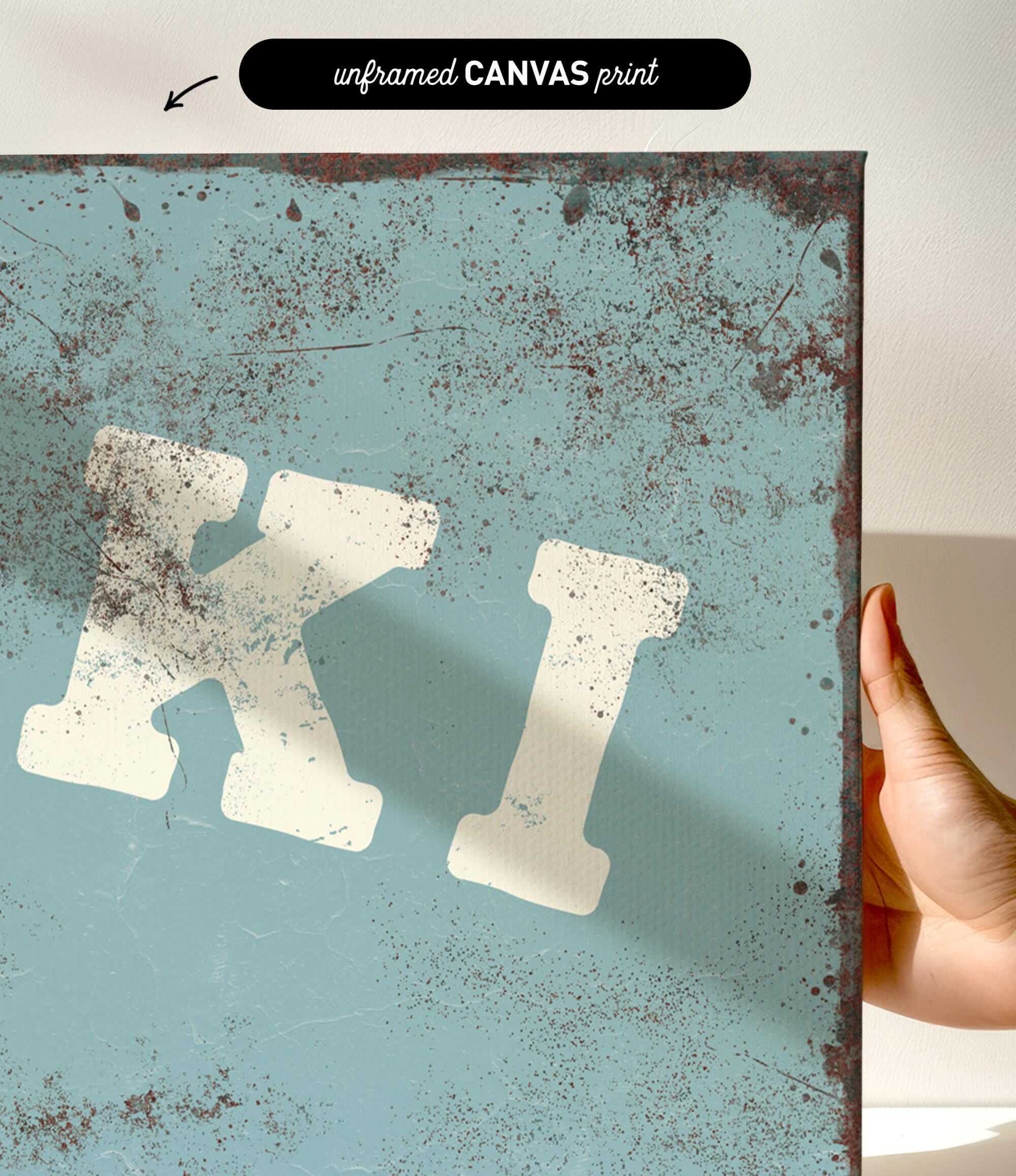 a close-up of a textured blue surface with a large white letter "K" prominently displayed.