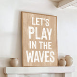 a wooden sign that says let&#39;s play in the waves